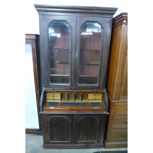 125 - A Victorian mahogany cylinder secretaire bookcase