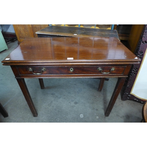 131 - A George II mahogany single drawer fold over tea table