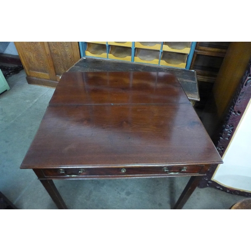 131 - A George II mahogany single drawer fold over tea table