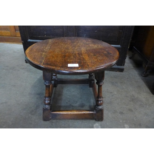 132 - An oak circular occasional table