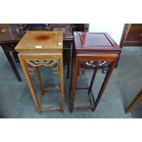 133 - A pair of Chinese hardwood jardiniere stands