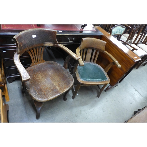 138 - Two Edward VII oak desk chairs