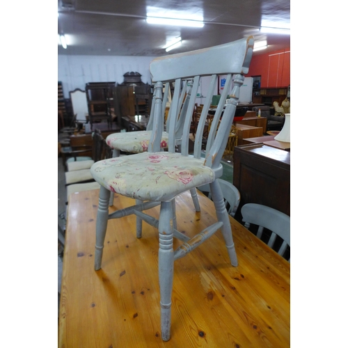 144 - A painted pine kitchen table and six chairs