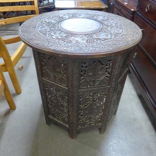 153 - An Anglo-Indian carved hardwood and brass inlaid occasional table