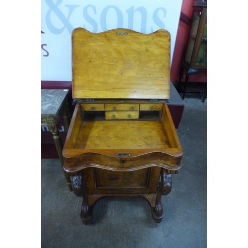 16 - A Victorian walnut Davenport