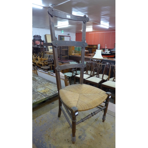 195 - An Arts and Crafts beech rush seated child's correction chair