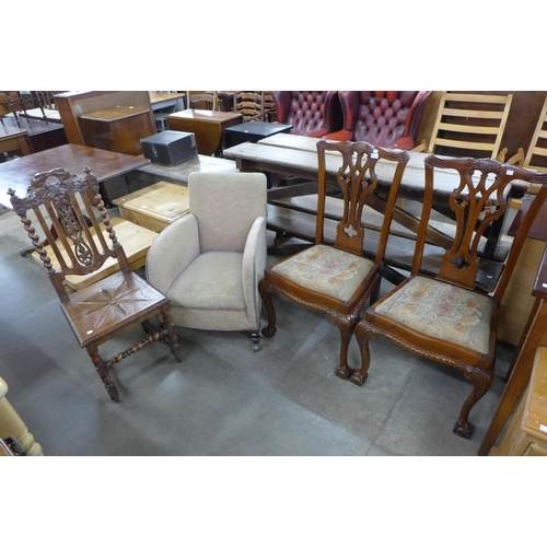 200 - A pair of Chippendale Revival carved mahogany chairs, a 19th Century French carved oak chair and an ... 