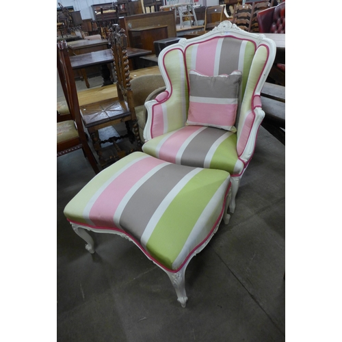 201 - A French cream and fabric upholstered fauteuil chair and stool