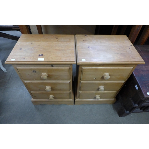 202 - A pair of pine bedside chests