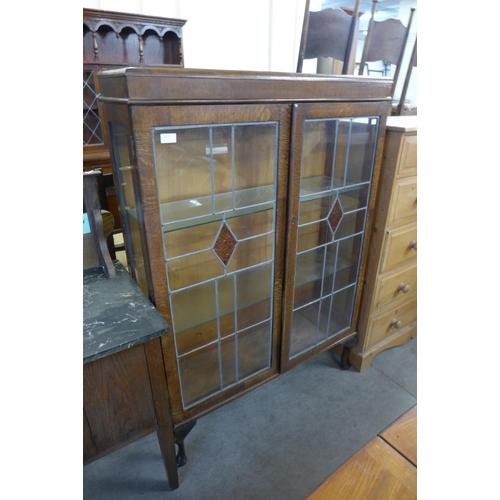 214 - An oak two door display cabinet