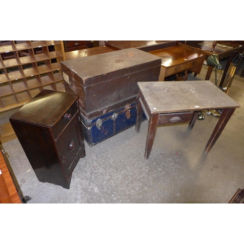 236 - Two vintage steamer trunks, a desk and a mahogany pot cupboard