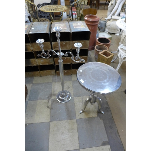 275 - A chrome bistro table and a candle stand