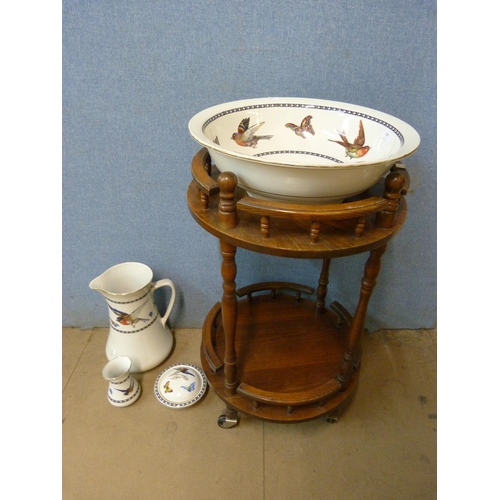 289 - A beech washstand, with porcelain bowl and jug