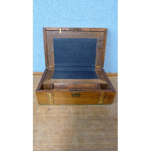 322 - A Victorian inlaid walnut writing slope