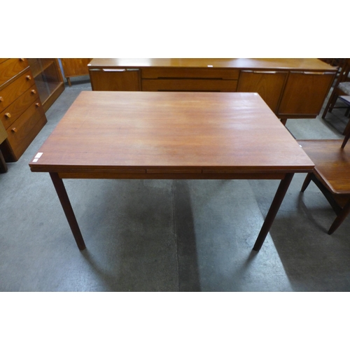 53 - A Danish teak extending dining table