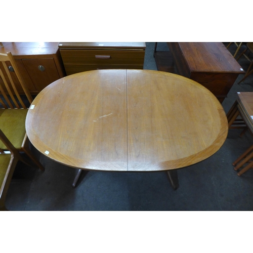 72 - A Nathan teak extending dining table