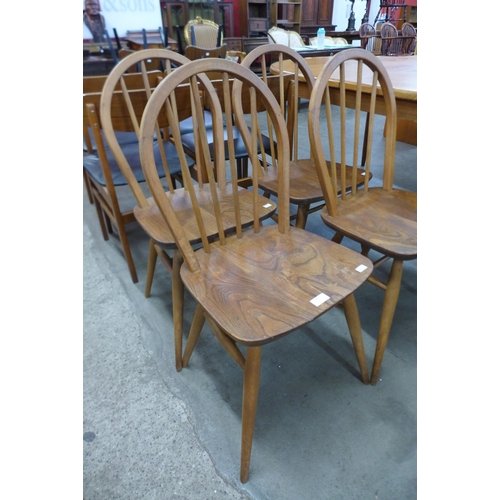 82 - A set of four Ercol elm and beech Windsor chairs