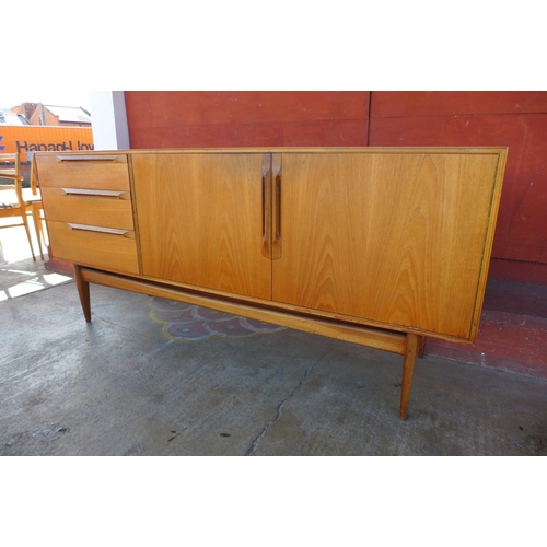 88k - A McIntosh Eden teak sideboard, extending dining table and six chairs