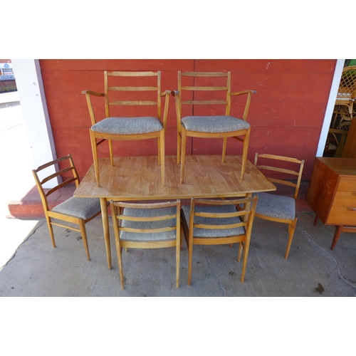 88k - A McIntosh Eden teak sideboard, extending dining table and six chairs