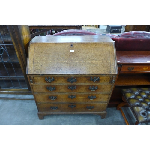 99 - A George III oak bureau