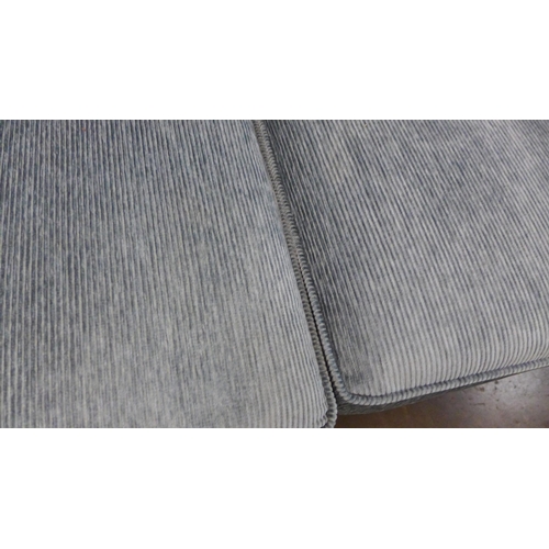 1401 - An aquamarine corduroy two seater sofa