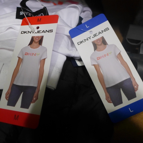 3290 - 2 White DKNY girl's T-shirts and a XXL black Berghaus gilet (ALL MARKED) * this lot is subject to VA... 