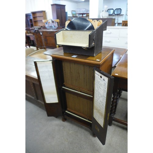 171 - An HMV mahogany record index cabinet and a case of records