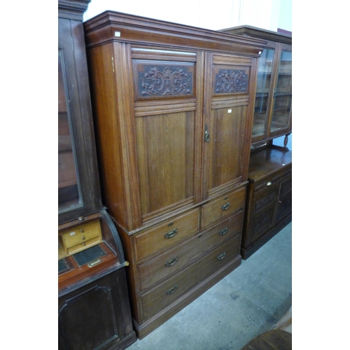 232 - A Victorian ash linen press (lacking interior slides)