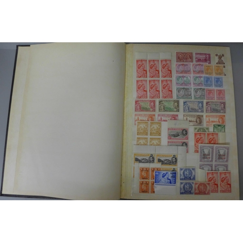 669 - Stamps: King George VI unmounted mint Commonwealth stamps in sixteen page stock book