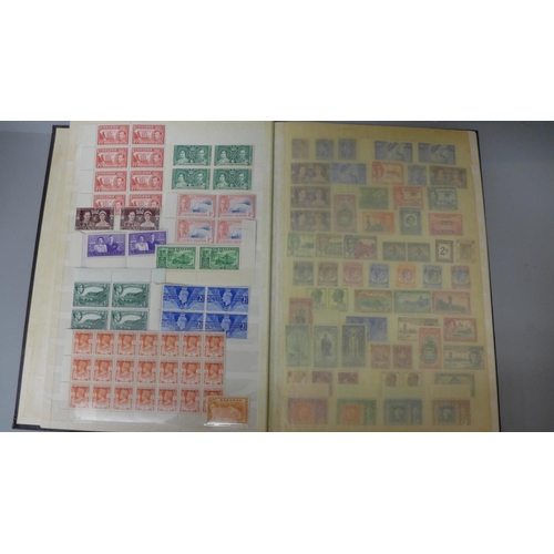 669 - Stamps: King George VI unmounted mint Commonwealth stamps in sixteen page stock book