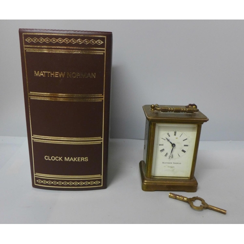 680 - A Matthew Norman four glass sided brass timepiece, boxed