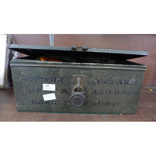 696 - A military tin with dummy hand grenade, a gas mask canvas case, canvas belts, regimental patches, sp... 