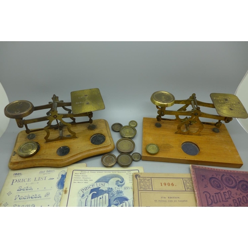 702 - Two sets of postal scales and weights and early 20th Century stamp price guides