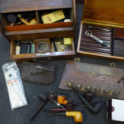 709 - A large collection of pipes, boxed and loose, including Meerschaum, Dunhill, three pipe racks, and a... 