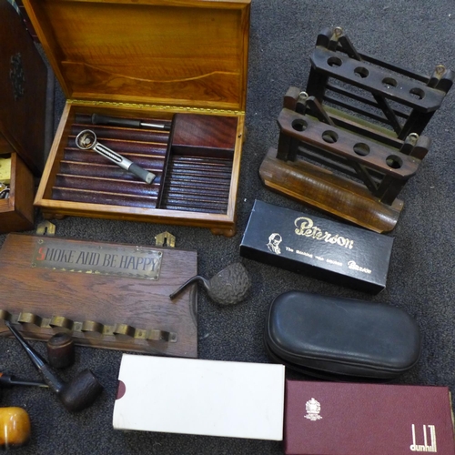 709 - A large collection of pipes, boxed and loose, including Meerschaum, Dunhill, three pipe racks, and a... 