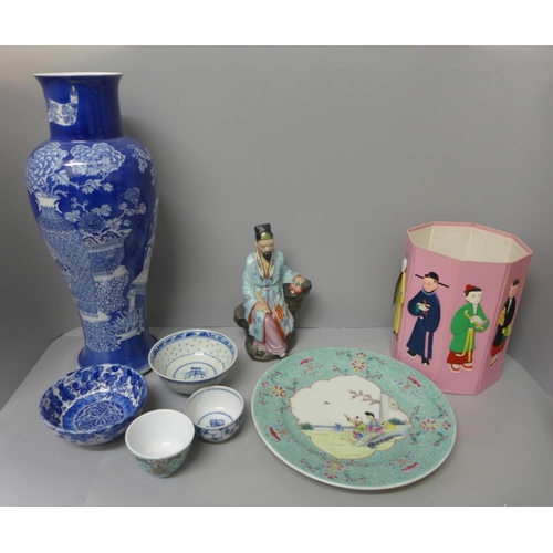 725 - Oriental items; a blue and white vase, 41cm, a porcelain figure, a plate and small bowls