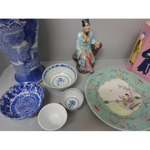 725 - Oriental items; a blue and white vase, 41cm, a porcelain figure, a plate and small bowls