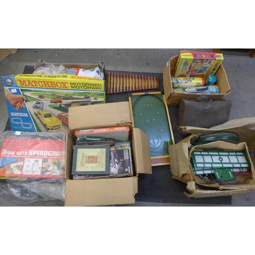 735 - A collection of vintage toys and games, two dolls, Matchbox Motorised Motorway, a bagatelle board, S... 