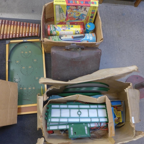 735 - A collection of vintage toys and games, two dolls, Matchbox Motorised Motorway, a bagatelle board, S... 