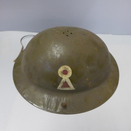 759 - A child's size military helmet with key hole insignia, no liner