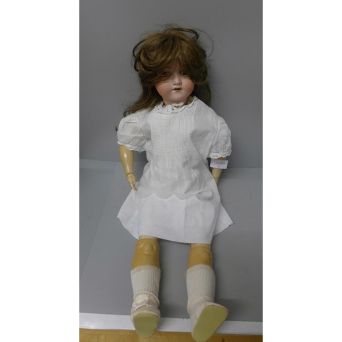 780 - An Armand Marseille bisque head doll with composition body, 60cm