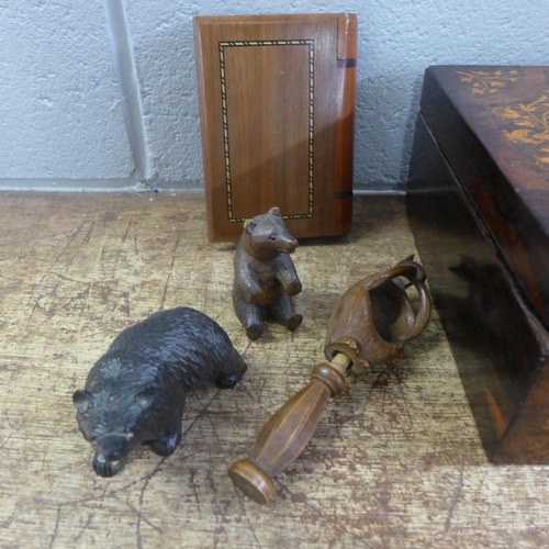 788 - An inlaid box, two carved wooden, a carved nutcracker in the form of a squirrel, a secret compartmen... 