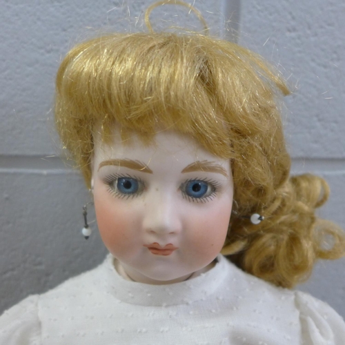 789 - A modern bisque head doll, 55cm