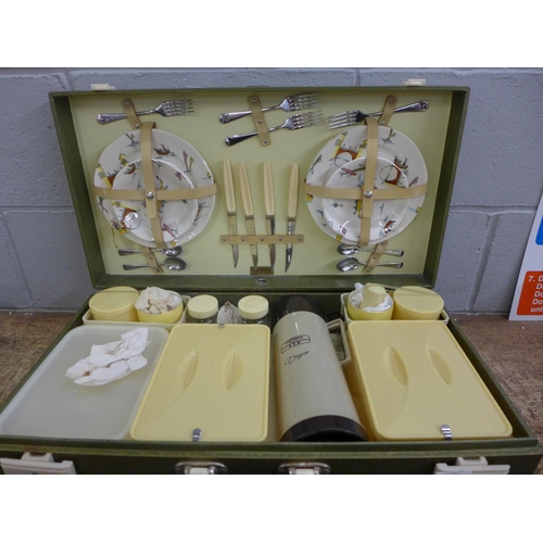 795 - A large Brexton picnic hamper with Bakelite fittings to the case