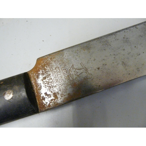 803 - A US issue machete and scabbard, dated 1945