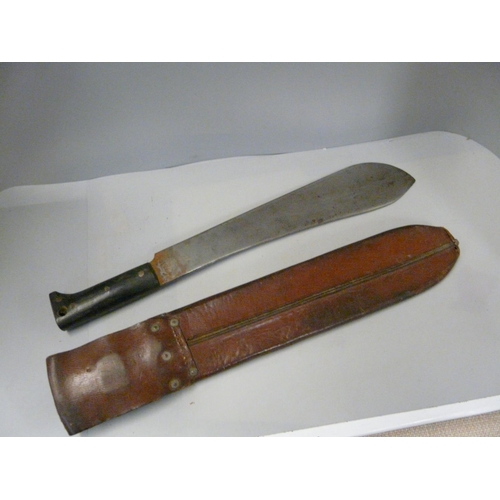 803 - A US issue machete and scabbard, dated 1945