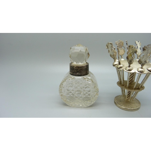 824 - A cocktail stick stand and a silver mounted scent bottle