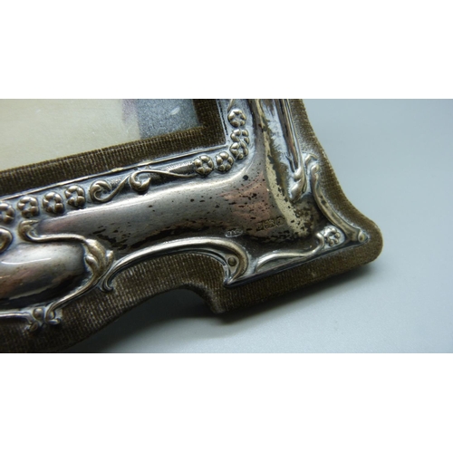 833 - A silver photograph frame, height 21cm