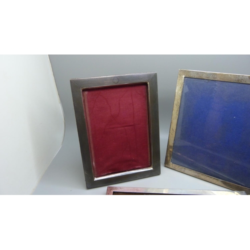 847 - Three silver photograph frames, largest 17cm x 22cm, (middle size lacking back stand)