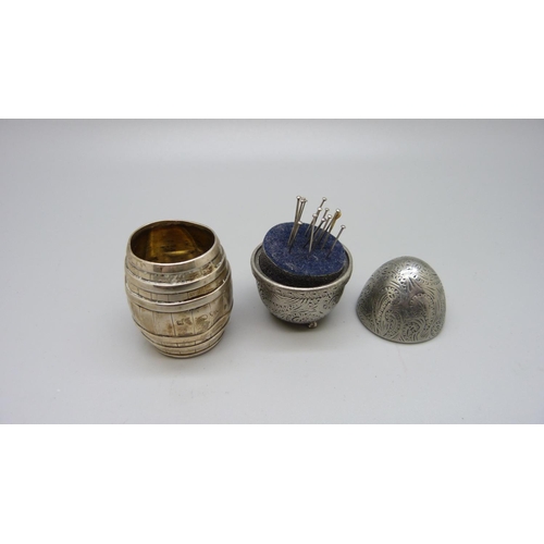 861 - A Victorian silver barrel shaped match strike and an egg shaped needle holder